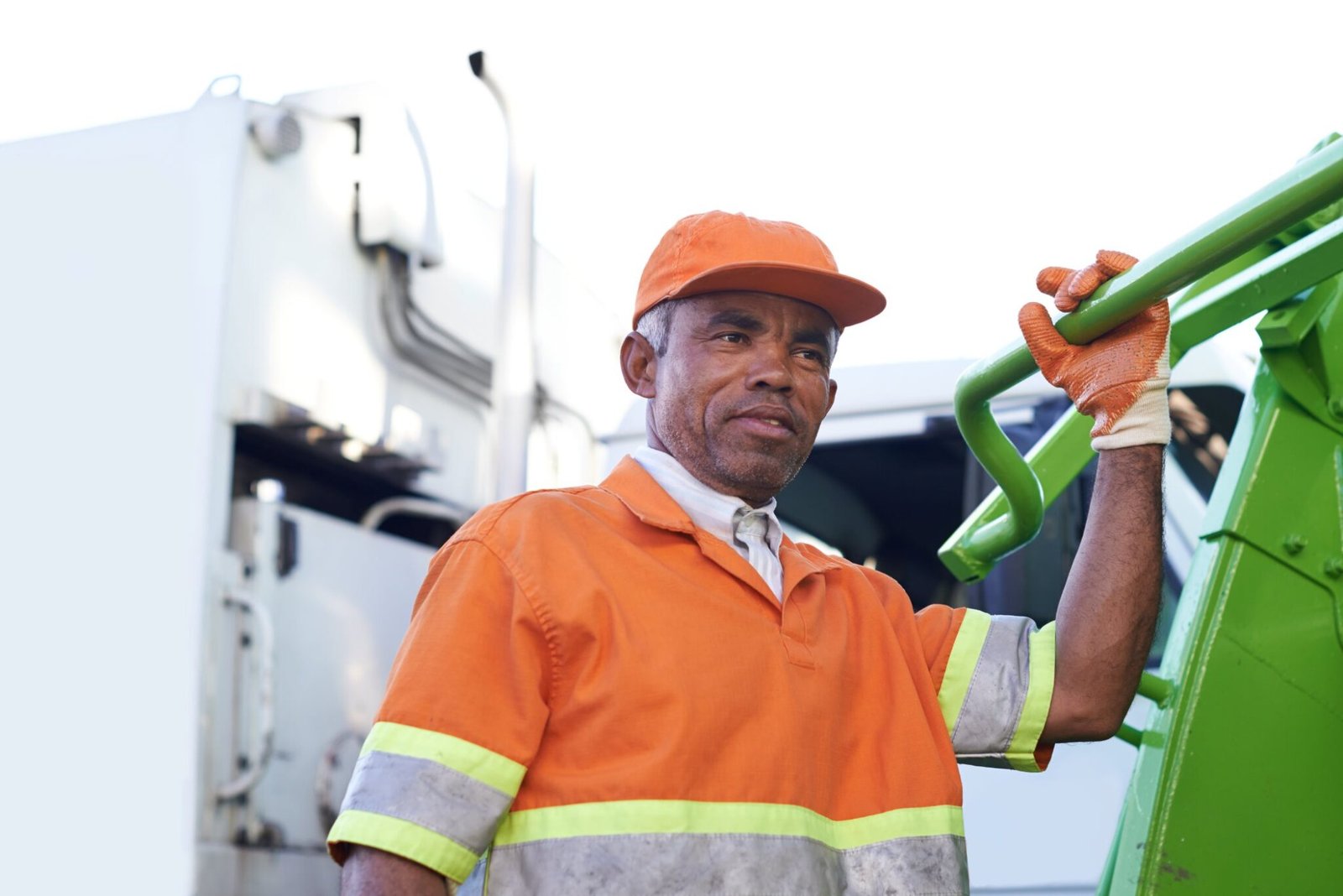 Worker in a hi-vis vest collecting waste